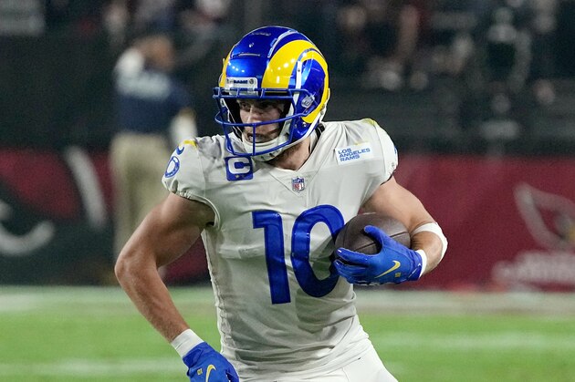 Los Angeles Rams wide receiver Cooper Kupp runs with the ball after making a catch against the Arizona Cardinals during the first half of an NFL football game Monday, Dec. 13, 2021, in Glendale, Ariz. (AP Photo/Rick Scuteri)