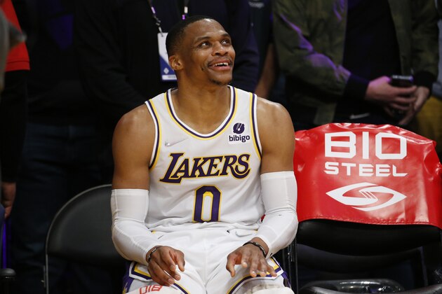 Los Angeles Lakers guard Russell Westbrook (0) smiles in the bench during the second half of an NBA basketball game against the Orlando Magic in Los Angeles, Sunday, Dec. 12, 2021. The Lakers won 106-94. (AP Photo/Ringo H.W. Chiu)