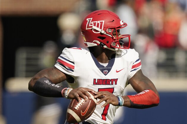 Liberty quarterback Malik Willis (7) passes against Mississippi during the first half of an NCAA college football game in Oxford, Miss., Saturday, Nov. 6, 2021. Mississippi won 27-14. (AP Photo/Rogelio V. Solis)