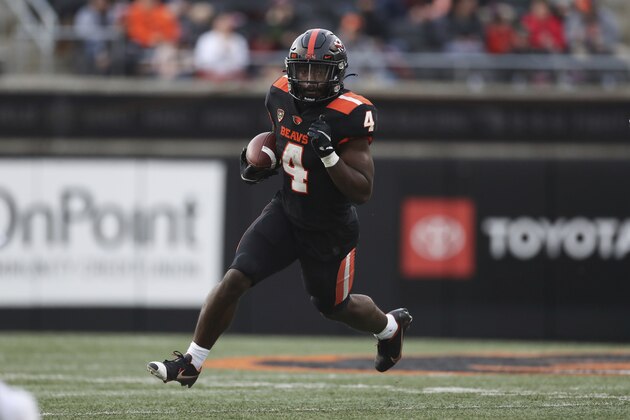Oregon State running back B.J. Baylor (4) rushes against Stanford during the first half of an NCAA college football game Saturday, Nov. 13, 2021, in Corvallis, Ore. Oregon State won 35-14. (AP Photo/Amanda Loman)
