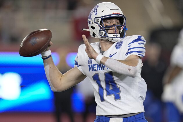 Memphis quarterback Seth Henigan throws a pass during the second half of the team's NCAA college football game against Houston, Friday, Nov. 19, 2021, in Houston. (AP Photo/Eric Christian Smith)