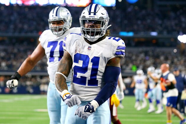 ARLINGTON, TEXAS - DECEMBER 26: Ezekiel Elliott #21 of the Dallas Cowboys celebrates after rushing for a touchdown during the second quarter against the Washington Football Team at AT&T Stadium on December 26, 2021 in Arlington, Texas. (Photo by Richard Rodriguez/Getty Images)