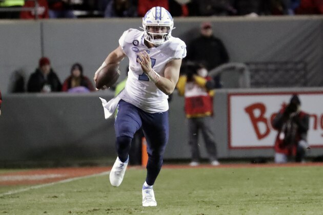 North Carolina quarterback Sam Howell (7) runs the ball during an NCAA college football game against North Carolina State Friday, Nov. 26, 2021, in Raleigh, N.C. (AP Photo/Chris Seward)