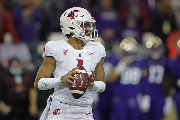 Washington State quarterback Jayden de Laura drops to pass against Washington during the first half of an NCAA college football game, Friday, Nov. 26, 2021, in Seattle. (AP Photo/Ted S. Warren)