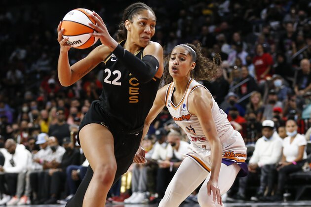 Las Vegas Aces forward A'ja Wilson (22) drives to the basket against Phoenix Mercury guard Skylar Diggins-Smith during the second half of Game 5 of a WNBA basketball playoff series Friday, Oct. 8, 2021, in Las Vegas. (AP Photo/Chase Stevens)