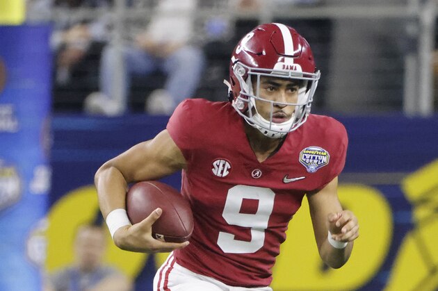 Alabama quarterback Bryce Young (9) runs with the ball during the Cotton Bowl NCAA College Football Playoff semifinal game, Friday, Dec. 31, 2021, in Arlington, Texas. (AP Photo/Michael Ainsworth)