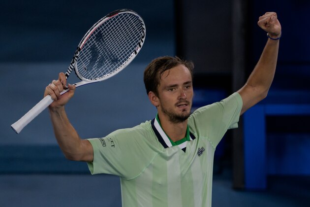 MELBOURNE, AUSTRALIA - JANUARY 28: Daniel Medvedev of Russia celebrates his victory over Stefanos Tsitsipas of Greece in the semi-final of the men's singles during day 12 of the 2022 Australian Open at Melbourne Park on January 28, 2022 in Melbourne, Australia. (Photo by TPN/Getty Images)