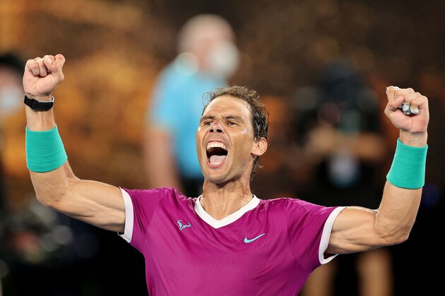 Spain's Rafael Nadal celebrates after winning the men's singles final match against Russia's Daniil Medvedev on day fourteen of the Australian Open tennis tournament in Melbourne on January 31, 2022. - -- IMAGE RESTRICTED TO EDITORIAL USE - STRICTLY NO COMMERCIAL USE -- (Photo by Martin KEEP / AFP) / -- IMAGE RESTRICTED TO EDITORIAL USE - STRICTLY NO COMMERCIAL USE -- (Photo by MARTIN KEEP/AFP via Getty Images)