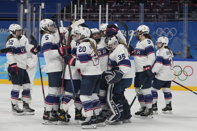 United States players celebrate after a win over Finland in a preliminary round women's hockey game at the 2022 Winter Olympics, Thursday, Feb. 3, 2022, in Beijing. (AP Photo/Petr David Josek)