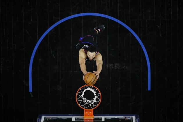 Philadelphia 76ers' Ben Simmons goes up for a dunk during overtime in an NBA basketball game against the Milwaukee Bucks, Wednesday, March 17, 2021, in Philadelphia. (AP Photo/Matt Slocum)