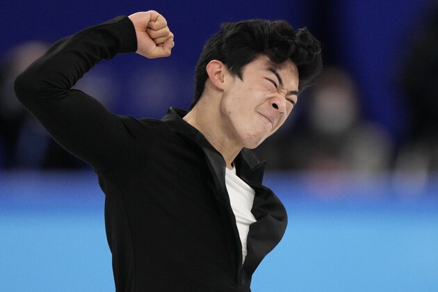 Nathan Chen, of the United States, reacts following the men's short program figure skating competition at the 2022 Winter Olympics, Tuesday, Feb. 8, 2022, in Beijing. (AP Photo/Bernat Armangue)