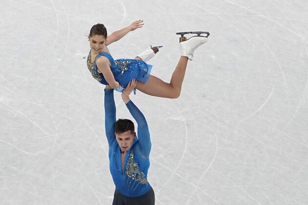 Anastasia Mishina and Aleksandr Galliamov, of the Russian Olympic Committee, compete in the pairs team free skate program during the figure skating competition at the 2022 Winter Olympics, Monday, Feb. 7, 2022, in Beijing. (AP Photo/Jeff Roberson) Anastasia Mishina and Aleksandr Galliamov, of the Russian Olympic Committee, compete in the pairs team free skate program during the figure skating competition at the 2022 Winter Olympics, Monday, Feb. 7, 2022, in Beijing. (AP Photo/Jeff Roberson)