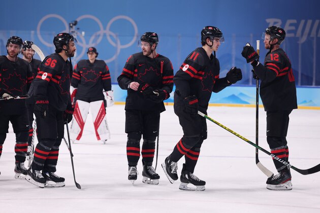 BEIJING, CHINA - FEBRUARY 10: (R-L) Eric Staal #12, Jack McBain #11, Tyler Wotherspoon #23 and Josh Ho-Sang #96 of Team Canada celebrate after defeating Team Germany 5-1 in the Men's Ice Hockey Preliminary Round Group A match on Day 6 of the Beijing 2022 Winter Olympic Games at Wukesong Sports Centre on February 10, 2022 in Beijing, China. (Photo by Harry How/Getty Images)