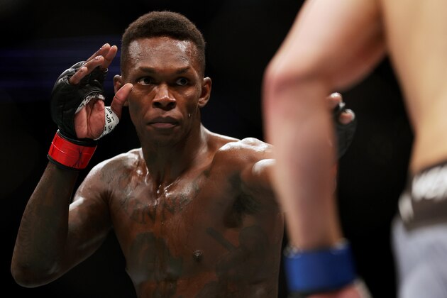 HOUSTON, TEXAS - FEBRUARY 12: Israel Adesanya of Nigeria looks on in his middleweight championship fight against Robert Whittaker of Australia during UFC 271 at Toyota Center on February 12, 2022 in Houston, Texas. (Photo by Carmen Mandato/Getty Images)