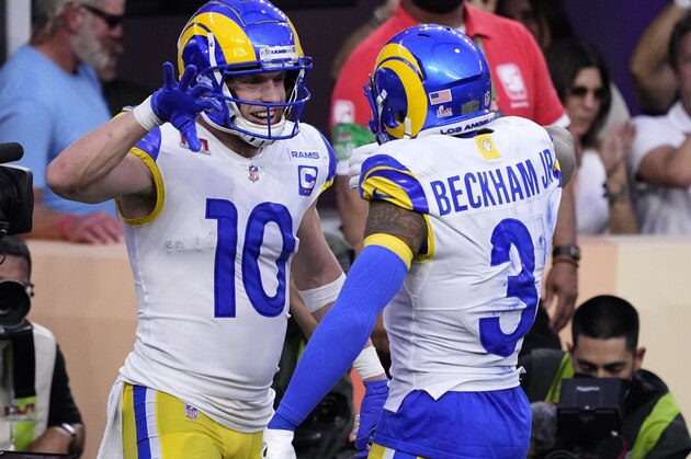 Los Angeles Rams wide receiver Cooper Kupp (10) celebrates his touchdown catch with wide receiver Odell Beckham Jr. (3) during the first half of the NFL Super Bowl 56 football game against the Cincinnati Bengals, Sunday, Feb. 13, 2022, in Inglewood, Calif. (AP Photo/Elaine Thompson)