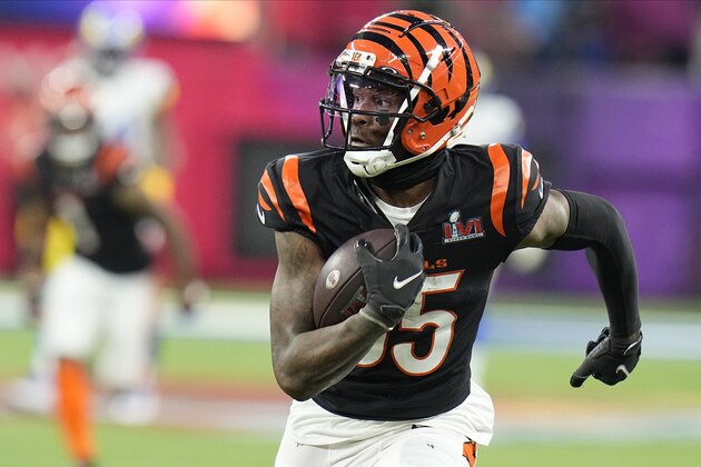 Cincinnati Bengals wide receiver Tee Higgins (85) runs for a touchdown after catching a pass against the Los Angeles Rams during the second half of the NFL Super Bowl 56 football game Sunday, Feb. 13, 2022, in Inglewood, Calif. (AP Photo/Chris O'Meara)