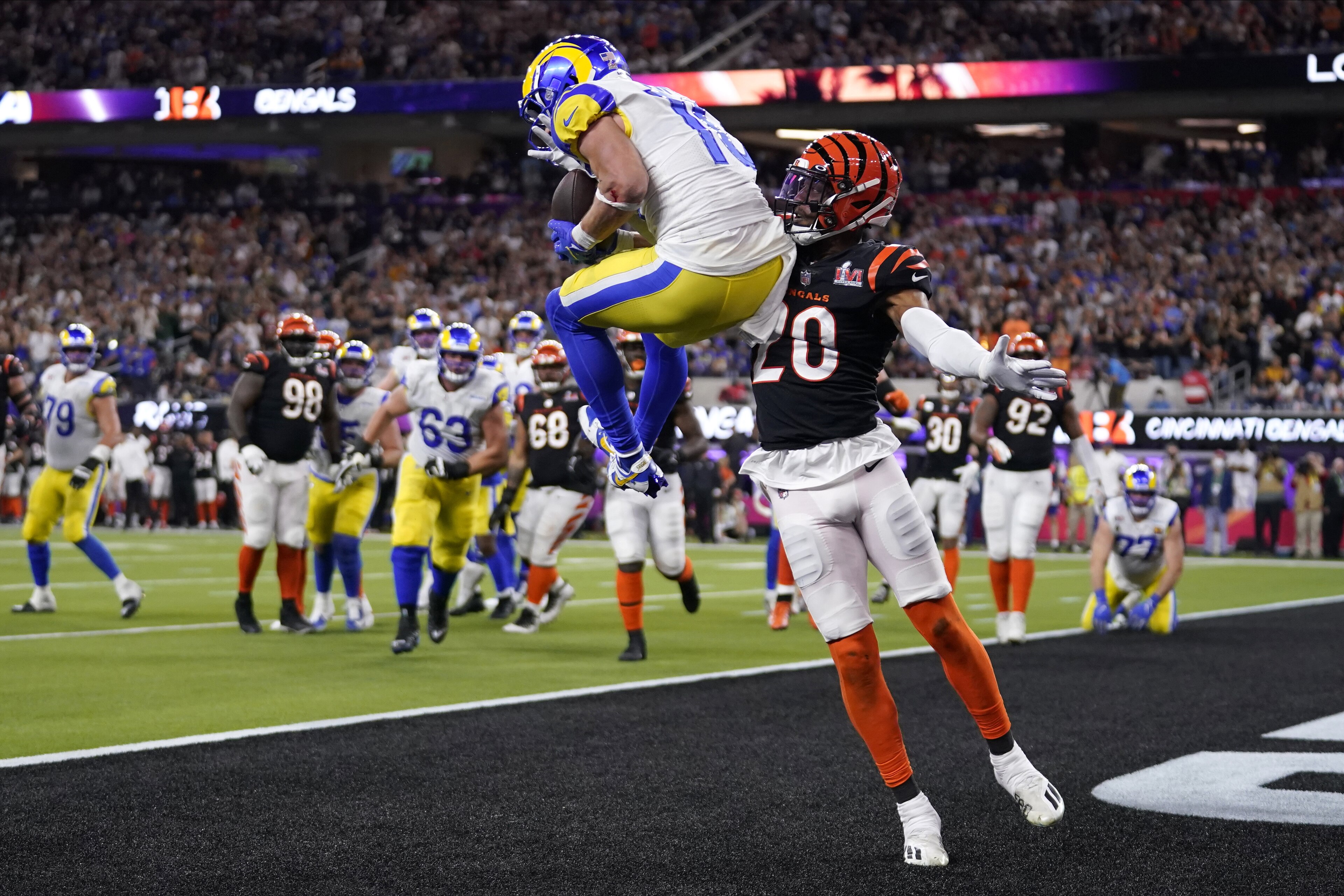 Los Angeles Rams wide receiver Cooper Kupp, top, catches a touchdown against Cincinnati Bengals cornerback Eli Apple during the second half of the NFL Super Bowl 56 football game Sunday, Feb. 13, 2022, in Inglewood, Calif. (AP Photo/Marcio Jose Sanchez) Los Angeles Rams wide receiver Cooper Kupp, top, catches a touchdown against Cincinnati Bengals cornerback Eli Apple during the second half of the NFL Super Bowl 56 football game Sunday, Feb. 13, 2022, in Inglewood, Calif. (AP Photo/Marcio Jose Sanchez)