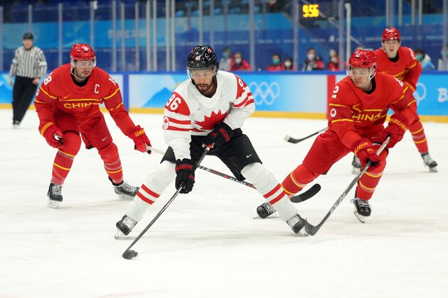 BEIJING, CHINA - FEBRUARY 13: Josh Ho-Sang #96 of Team Canada holds off challenge of Jie Liu #2 of Team China during the Men's Ice Hockey Preliminary Round Group A match between Team China and Team Canada on Day 9 of the Beijing 2022 Winter Olympic Games at National Indoor Stadium on February 13, 2022 in Beijing, China. (Photo by Lintao Zhang/Getty Images)