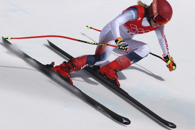 Mikaela Shiffrin, of the United States makes a turn during the women's downhill at the 2022 Winter Olympics, Tuesday, Feb. 15, 2022, in the Yanqing district of Beijing. (AP Photo/Alessandro Trovati)