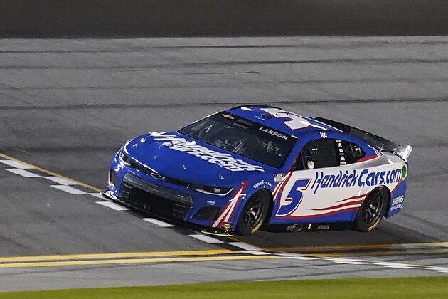 Kyle Larson crosses the finish line during qualifying for the NASCAR Daytona 500 auto race Wednesday, Feb. 16, 2022, at Daytona International Speedway in Daytona Beach, Fla. Larson took the pole position for Sunday's race. (AP Photo/Chris O'Meara)