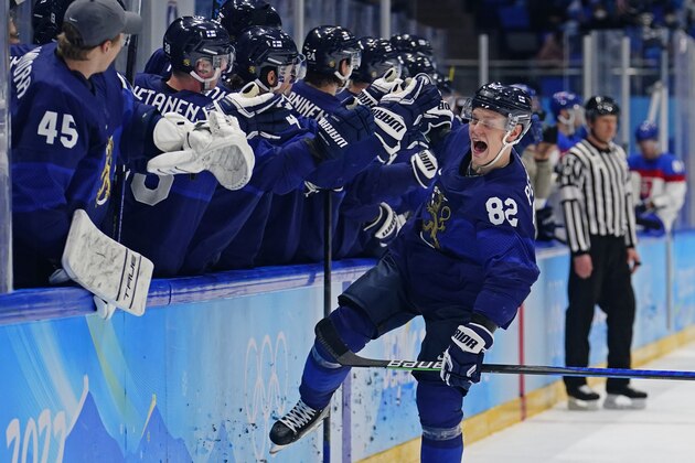 Finland's Harri Pesonen (82) celebrates after scoring a goal against Slovakia during a men's semifinal hockey game at the 2022 Winter Olympics, Friday, Feb. 18, 2022, in Beijing. Finland won 2-0. (AP Photo/Matt Slocum)