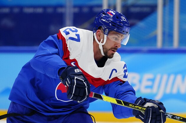Slovakia's Marek Hrivik warms up for a men's qualification round hockey game against Germany at the 2022 Winter Olympics, Tuesday, Feb. 15, 2022, in Beijing. (AP Photo/Matt Slocum)
