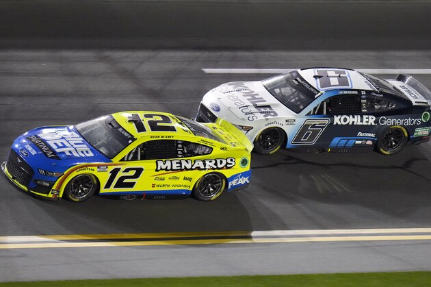 Brad Keselowski (6) begins to get around Ryan Blaney (12) during the first of two NASCAR Daytona 500 qualifying auto races Thursday, Feb. 17, 2022, at Daytona International Speedway in Daytona Beach, Fla. Keselowski won the race. (AP Photo/Chris O'Meara)