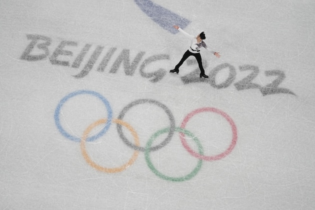 Vincent Zhou, of the United States, competes in the men's team free skate program during the figure skating competition at the 2022 Winter Olympics, Sunday, Feb. 6, 2022, in Beijing. (AP Photo/Jeff Roberson)