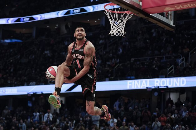 New York Knocks Obi Toppin goes up for a slam during the dunk contest part of the skills challenge competition, part of NBA All-Star basketball game weekend, Saturday, Feb. 19, 2022, in Cleveland. (AP Photo/Charles Krupa)