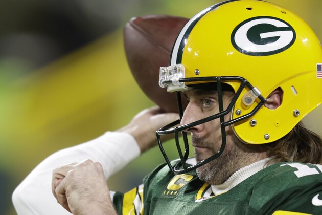 Green Bay Packers' Aaron Rodgers warms up before an NFC divisional playoff NFL football game against the San Francisco 49ers Saturday, Jan. 22, 2022, in Green Bay, Wis. (AP Photo/Matt Ludtke)