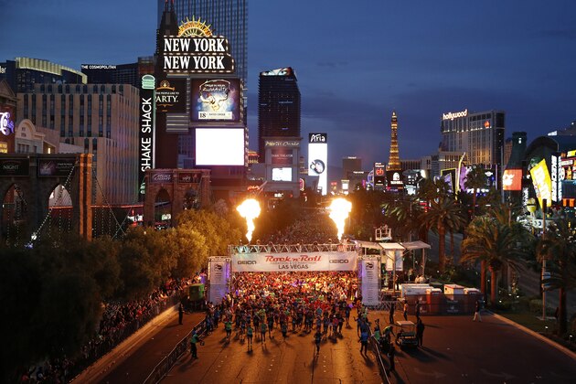 Runners start the Rock 'n' Roll Las Vegas Marathon along the Strip, Sunday, Nov. 12, 2017, in Las Vegas. (AP Photo/John Locher)