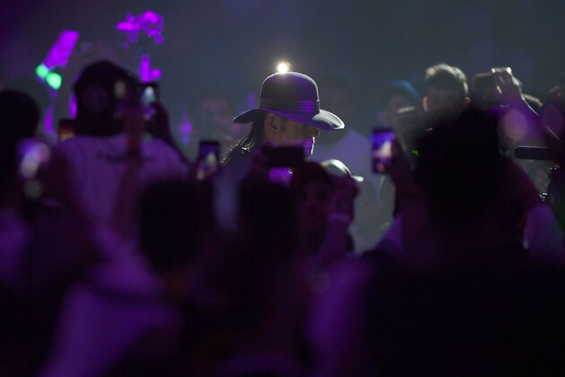 World Wrestling Entertainment star The Undertaker makes his way to the ring during a match at the World Wrestling Entertainment (WWE) Super Showdown event in the Saudi Red Sea port city of Jeddah late on January 7, 2019. (Photo by Amer HILABI / AFP)        (Photo credit should read AMER HILABI/AFP via Getty Images)