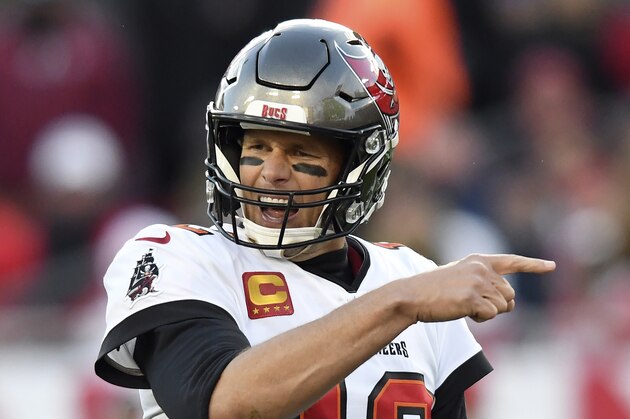 Tampa Bay Buccaneers quarterback Tom Brady (12) calls a play against the Los Angeles Rams during the second half of an NFL divisional round playoff football game Sunday, Jan. 23, 2022, in Tampa, Fla. (AP Photo/Jason Behnken)
