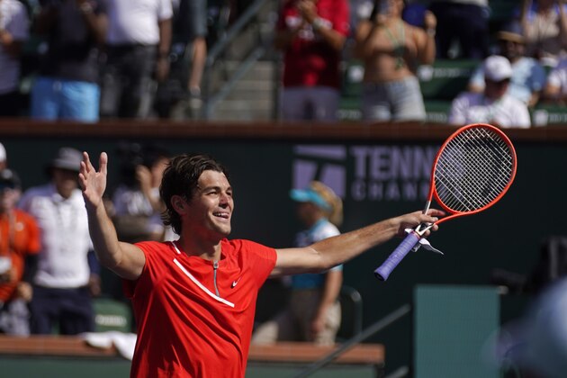 Taylor Fritz reacts after winning his men's singles semifinals match over Andrey Rublev, of Russia, at the BNP Paribas Open tennis tournament Saturday, March 19, 2022, in Indian Wells, Calif. Fritz won 7-5, 6-4. (AP Photo/Marcio Jose Sanchez)