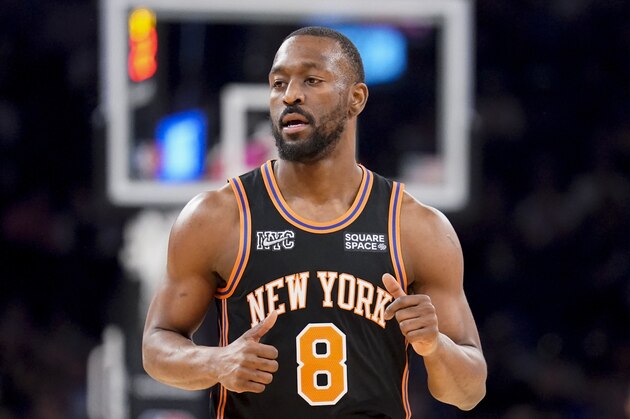 New York Knicks guard Kemba Walker (8) runs up the court during the first half of an NBA basketball game against the Brooklyn Nets, Wednesday, Feb. 16, 2022, in New York. (AP Photo/John Minchillo)