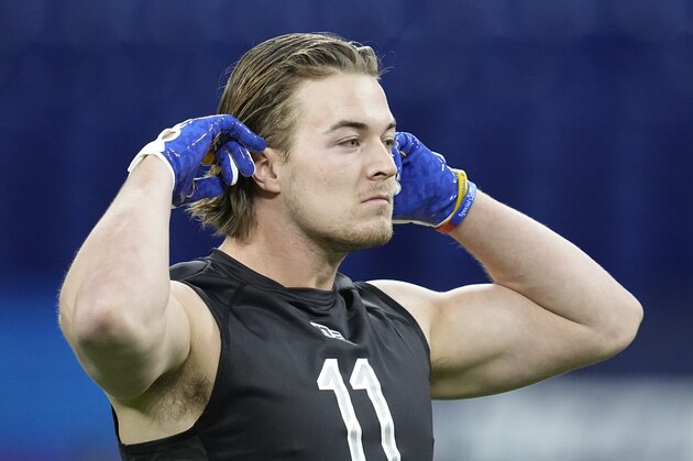 Pittsburgh quarterback Kenny Pickett waits to throw during the NFL football scouting combine, Thursday, March 3, 2022, in Indianapolis. (AP Photo/Darron Cummings)