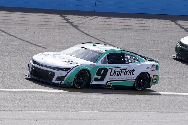 Chase Elliott (9) runs second at the halfway point of a NASCAR Cup Series auto race at Phoenix Raceway, Sunday, March 13, 2022, in Avondale, Ariz. (AP Photo/Darryl Webb)