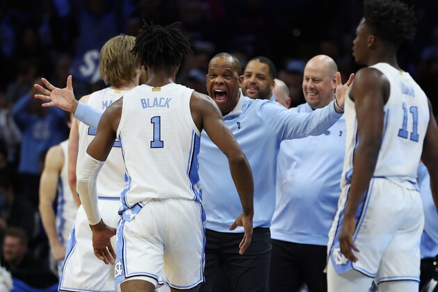 PHILADELPHIA, PENNSYLVANIA - MARCH 27: Head coach Hubert Davis of the North Carolina Tar Heels celebrates with Leaky Black #1 after defeating the St. Peter's Peacocks 69-49 in the Elite Eight round game of the 2022 NCAA Men's Basketball Tournament at Wells Fargo Center on March 27, 2022 in Philadelphia, Pennsylvania. (Photo by Patrick Smith/Getty Images)