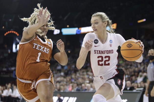 Stanford forward Cameron Brink (22) drives around the defense of Texas center Lauren Ebo (1) during the first half of a college basketball game in the Elite 8 round of the NCAA tournament, Sunday, March 27, 2022, in Spokane, Wash. (AP Photo/Young Kwak)