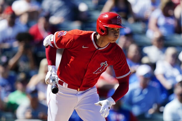 Los Angeles Angels' Shohei Ohtani, of Japan, runs out an infield grounder during the third inning of the team's spring training baseball game against the Chicago Cubs on Thursday, March 24, 2022, in Tempe, Ariz. Ohtani was out. (AP Photo/Ross D. Franklin)