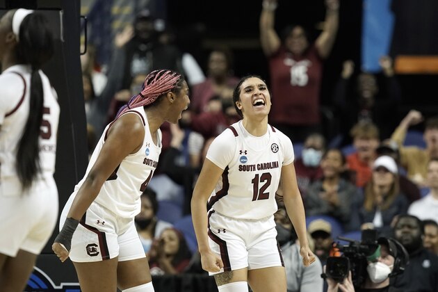 South Carolina forward Aliyah Boston (4) and guard Brea Beal (12) react during the first half of a college basketball game against Creighton in the Elite 8 round of the NCAA tournament in Greensboro, N.C., Sunday, March 27, 2022. (AP Photo/Gerry Broome)