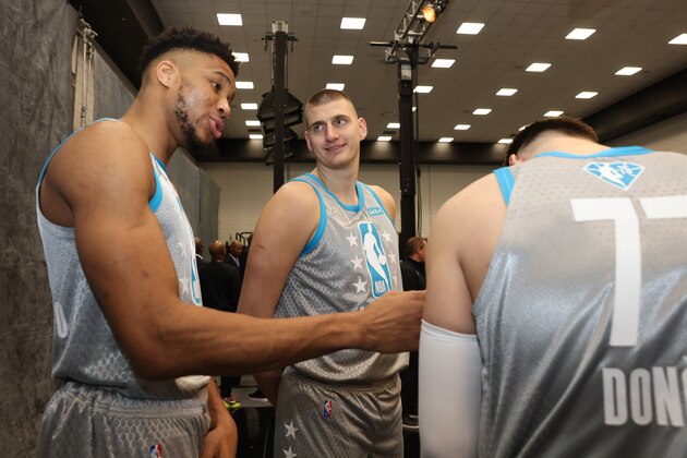 CLEVELAND, OH - FEBRUARY 20: Giannis Antetokounmpo #34, Nikola Jokic #15 and Luka Doncic #77 of Team LeBron talk during the NBA 75 Group Photo as part of the 2022 NBA All Star Weekend on February 20, 2022 at Rocket Mortgage FieldHouse in Cleveland, Ohio. NOTE TO USER: User expressly acknowledges and agrees that, by downloading and/or using this Photograph, user is consenting to the terms and conditions of the Getty Images License Agreement. Mandatory Copyright Notice: Copyright 2022 NBAE (Photo by Michael J. LeBrecht II/NBAE via Getty Images)
