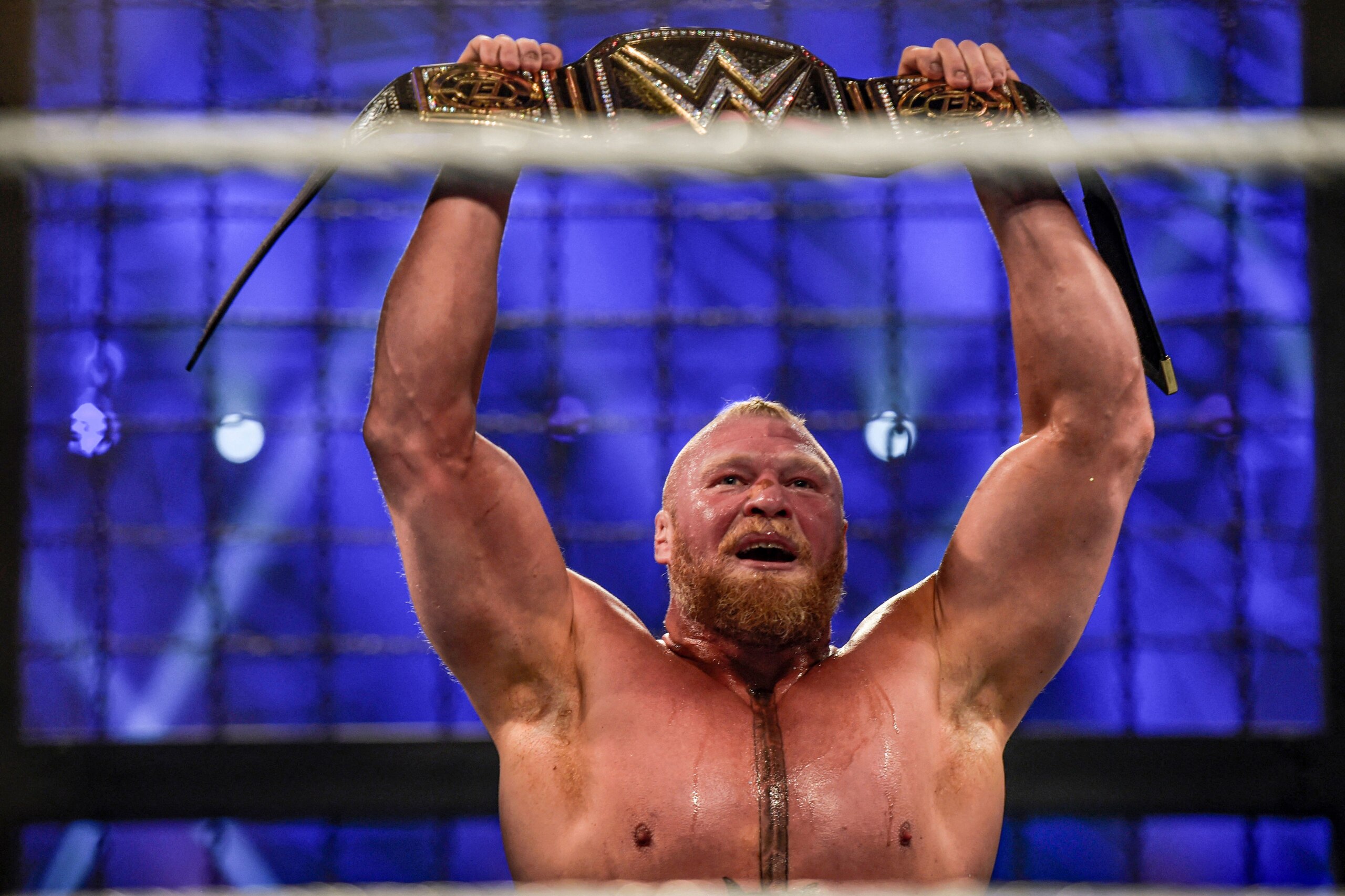 Brock Lesnar holds up the championship belt after winning the 2022 World Wrestling Entertainment (WWE) Elimination Chamber at the Jeddah Super Dome in Saudi Arabia's Red Sea coastal city of Jeddah on February 19, 2022. (Photo by Amer HILABI / AFP) (Photo by AMER HILABI/AFP via Getty Images) Brock Lesnar holds up the championship belt after winning the 2022 World Wrestling Entertainment (WWE) Elimination Chamber at the Jeddah Super Dome in Saudi Arabia's Red Sea coastal city of Jeddah on February 19, 2022. (Photo by Amer HILABI / AFP) (Photo by AMER HILABI/AFP via Getty Images)