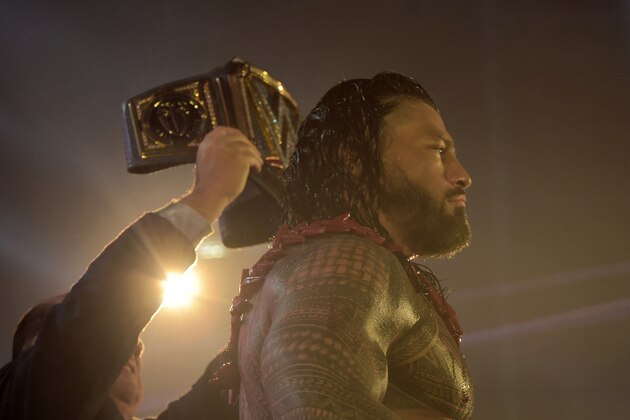 Roman Reigns wins a match during the 2022 WWE Elimination Chamber at the Jeddah Super Dome in Saudi Arabia's Red Sea coastal city of Jeddah on February 19, 2022. (Photo by Amer HILABI / AFP) (Photo by AMER HILABI/AFP via Getty Images)