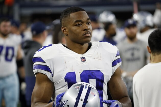 Dallas Cowboys wide receiver Amari Cooper walks in the bench area during the first half of an NFL football game against the Washington Football Team in Arlington, Texas, Sunday, Dec. 26, 2021. (AP Photo/Roger Steinman)