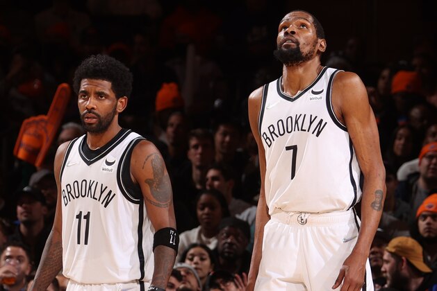 NEW YORK, NY - APRIL 6: Kyrie Irving #11 and Kevin Durant #7 of the Brooklyn Nets look on during the game against the New York Knicks on April 6, 2022 at Madison Square Garden in New York City, New York.  NOTE TO USER: User expressly acknowledges and agrees that, by downloading and or using this photograph, User is consenting to the terms and conditions of the Getty Images License Agreement. Mandatory Copyright Notice: Copyright 2022 NBAE  (Photo by Nathaniel S. Butler/NBAE via Getty Images)