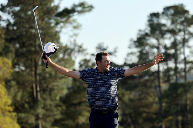 AUGUSTA, GEORGIA - APRIL 10: Scottie Scheffler celebrates on the 18th green after winning the Masters at Augusta National Golf Club on April 10, 2022 in Augusta, Georgia. (Photo by Gregory Shamus/Getty Images)