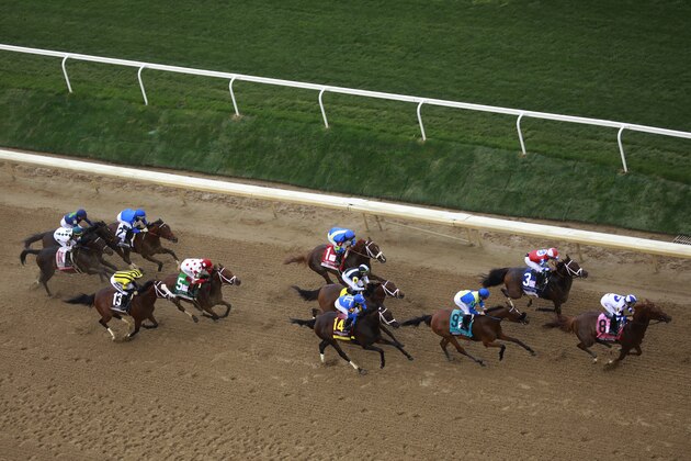 Thoroughbred racehorses run during the Kentucky Oaks race ahead of the 148th running of The Kentucky Derby at Churchill Downs in Louisville, Kentucky, U.S., on Friday, May 6, 2022. The Kentucky Derby will return on Saturday with a capacity crowd at Churchill Downs for the first time since 2019. Photographer: Luke Sharrett/Bloomberg via Getty Images