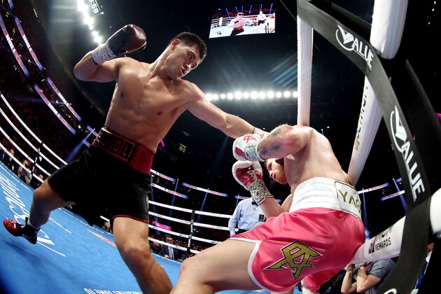 LAS VEGAS, NEVADA - MAY 07: Dmitry Bivol (L) throws a left at Canelo Alvarez during their WBA light heavyweight title fight at T-Mobile Arena on May 07, 2022 in Las Vegas, Nevada. (Photo by Al Bello/Getty Images)
