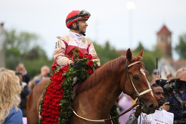 LOUISVILLE, KY - MAY 07: Jockey Sonny Leon aboard Rich Strike (21) is paraded in the winner's circle after winning the148th running of the Kentucky Derby on May 7th, 2022, at Churchill Downs in Louisville, Kentucky. (Photo by Brian Spurlock/Icon Sportswire via Getty Images)